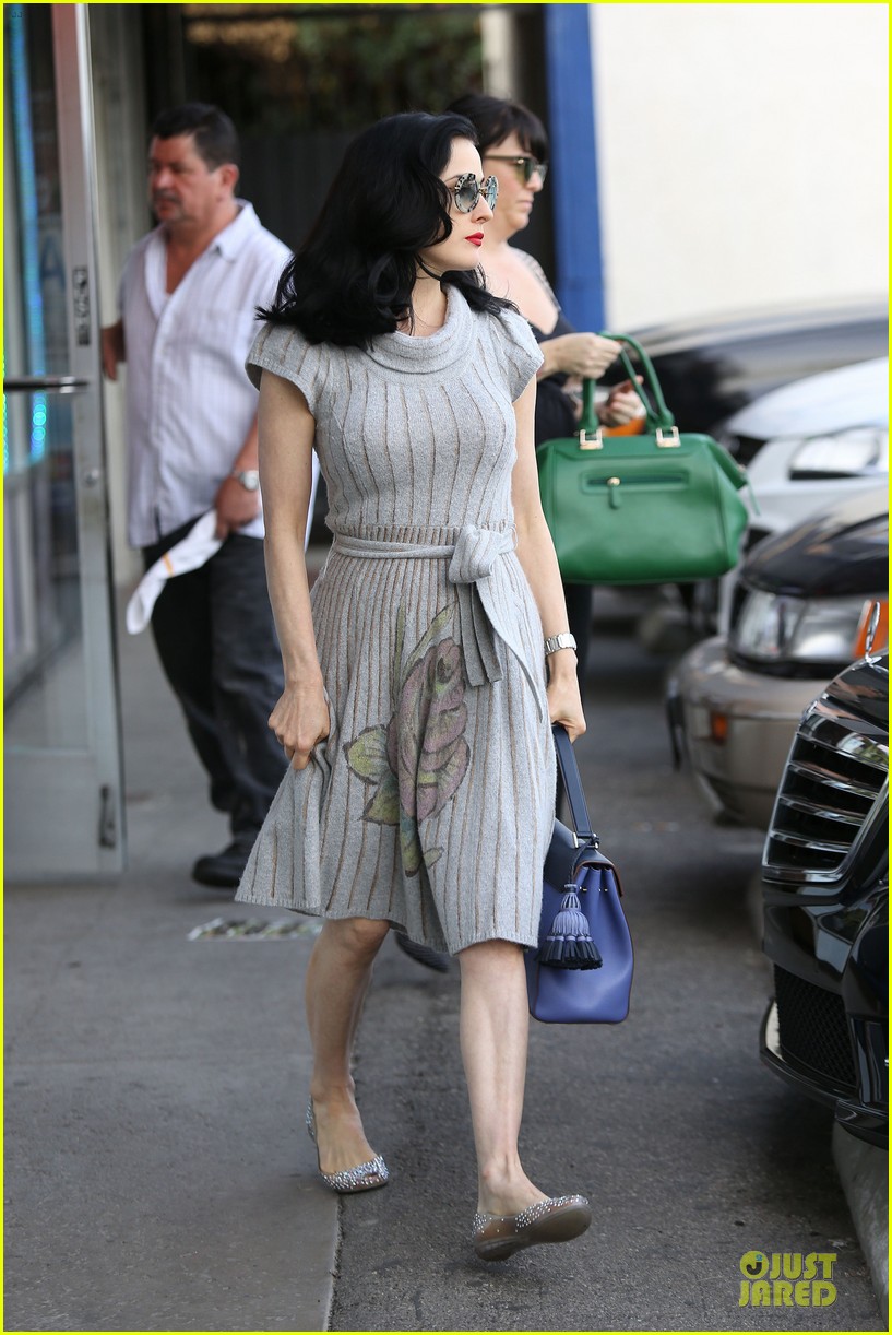 dita von teese sits in glass cup for bethenny appearance 133013921