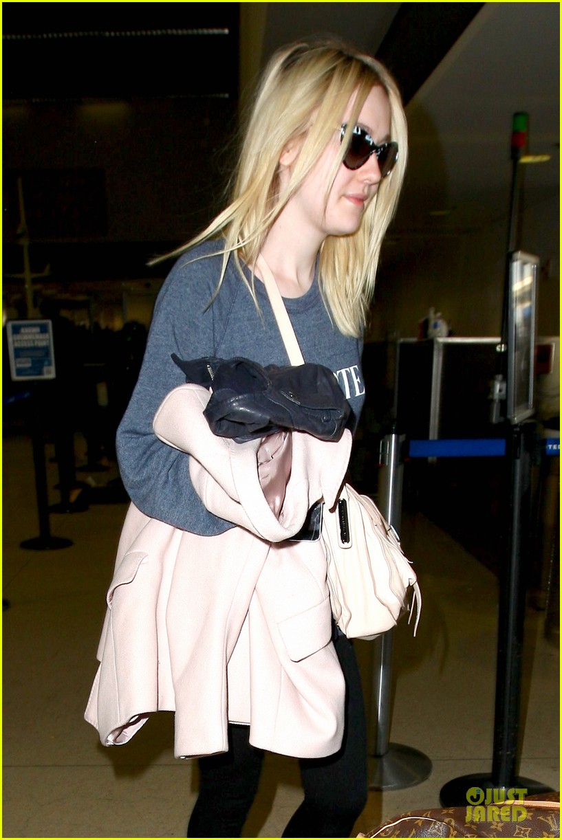 dakota fanning ends january with casual lax airport landing 09