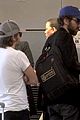 daft punk guys take helmets off for flight out of los angeles 05