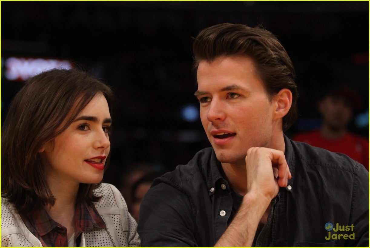 lily collins boyfriend thomas cocquerel hold hands at lakers game 01