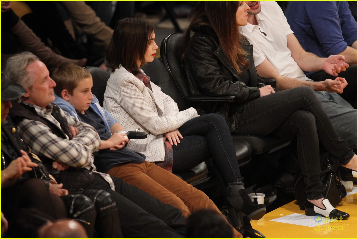 lily collins boyfriend thomas cocquerel hold hands at lakers game 043050576