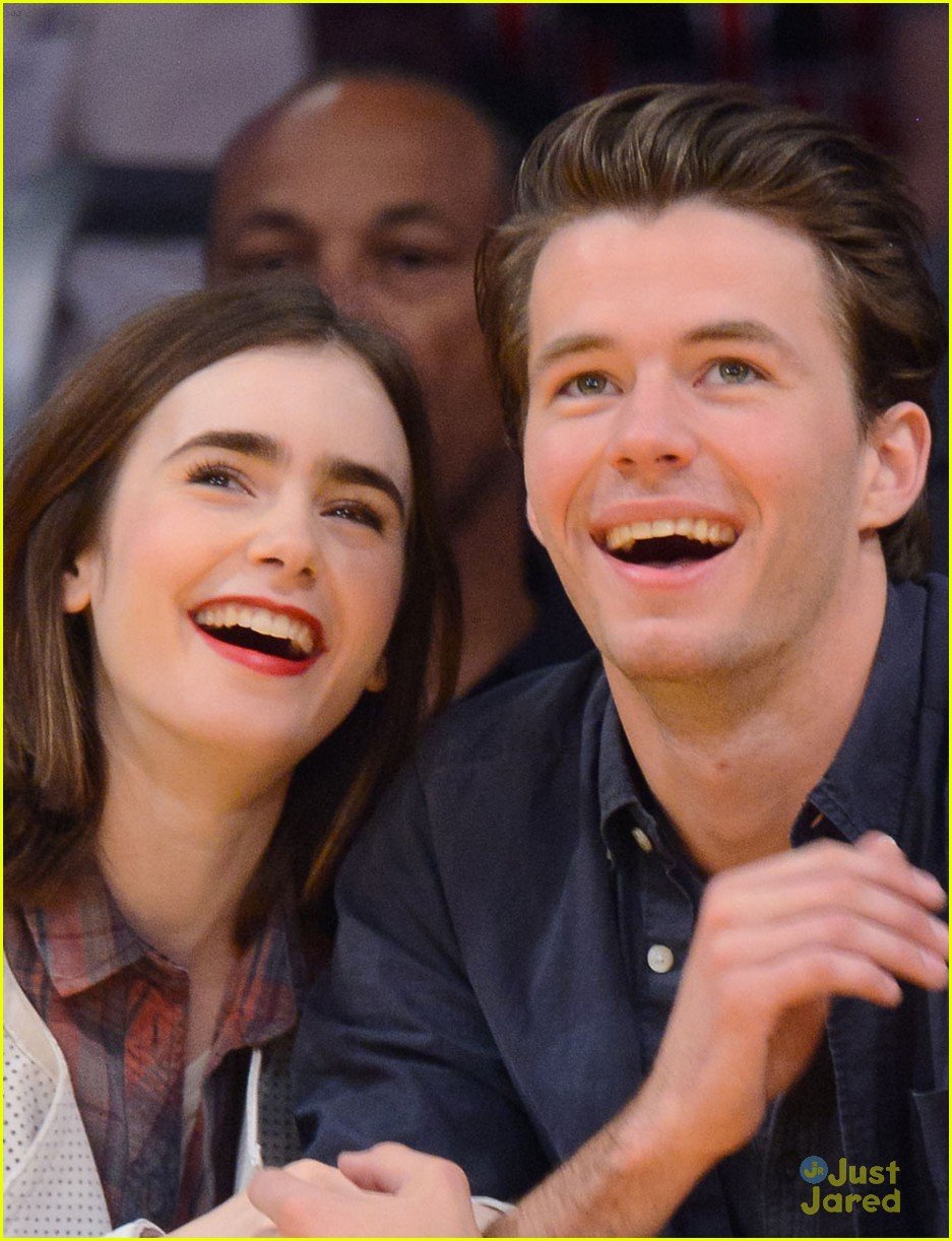 lily collins boyfriend thomas cocquerel hold hands at lakers game 053050577