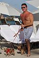 shirtless simon cowell tends to his cute pups on miami vacation 01