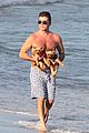 shirtless simon cowell tends to his cute pups on miami vacation 03