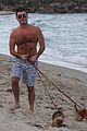 shirtless simon cowell tends to his cute pups on miami vacation 05