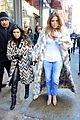 kim kardashian films kuwtk with her sisters khloe sends message on coat fxck yo fur 09