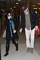 mila kunis ashton kutcher hold hands upon arrival in nyc 05