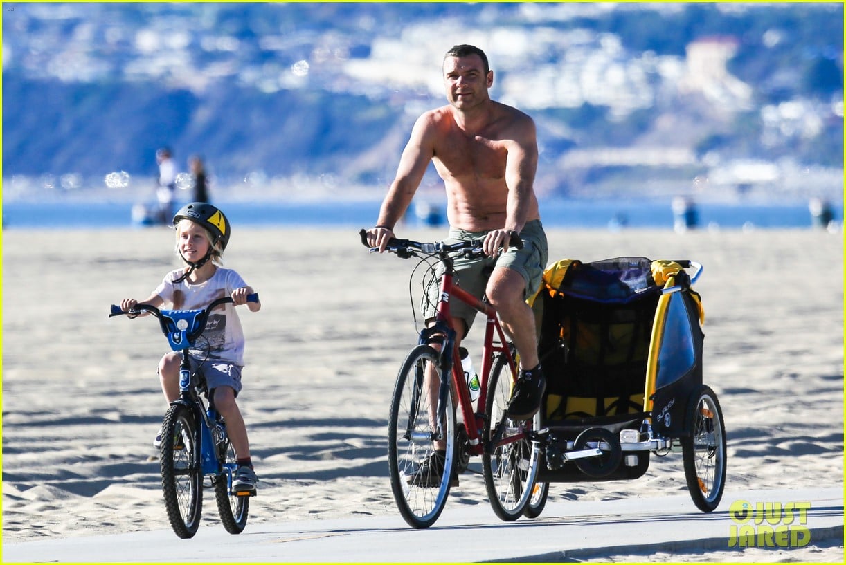 liev schreiber bares hot shirtless bod for family bike ride 253045884