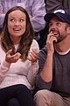 olivia wilde jason sudeikis passionately kiss at clippers game 02