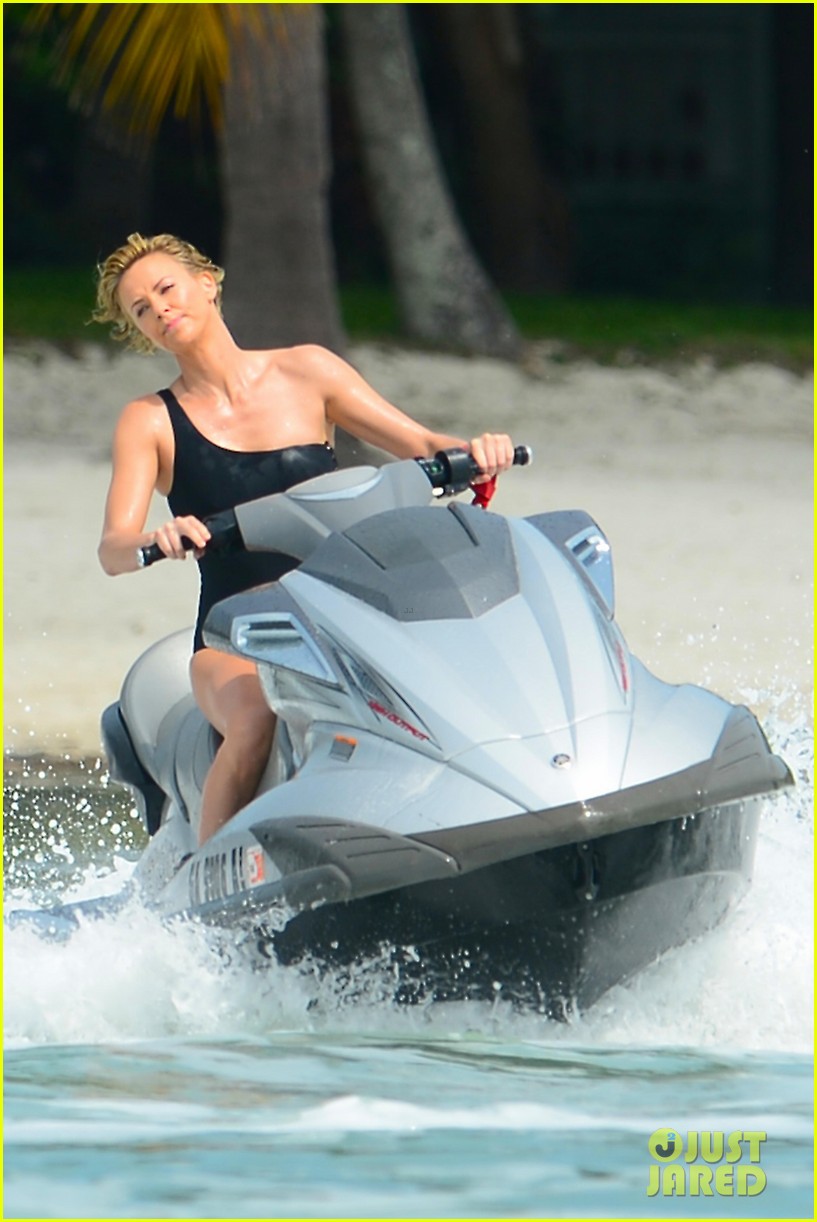 charlize therons bathing suit body is so enviable during jet ski shoot 023075467