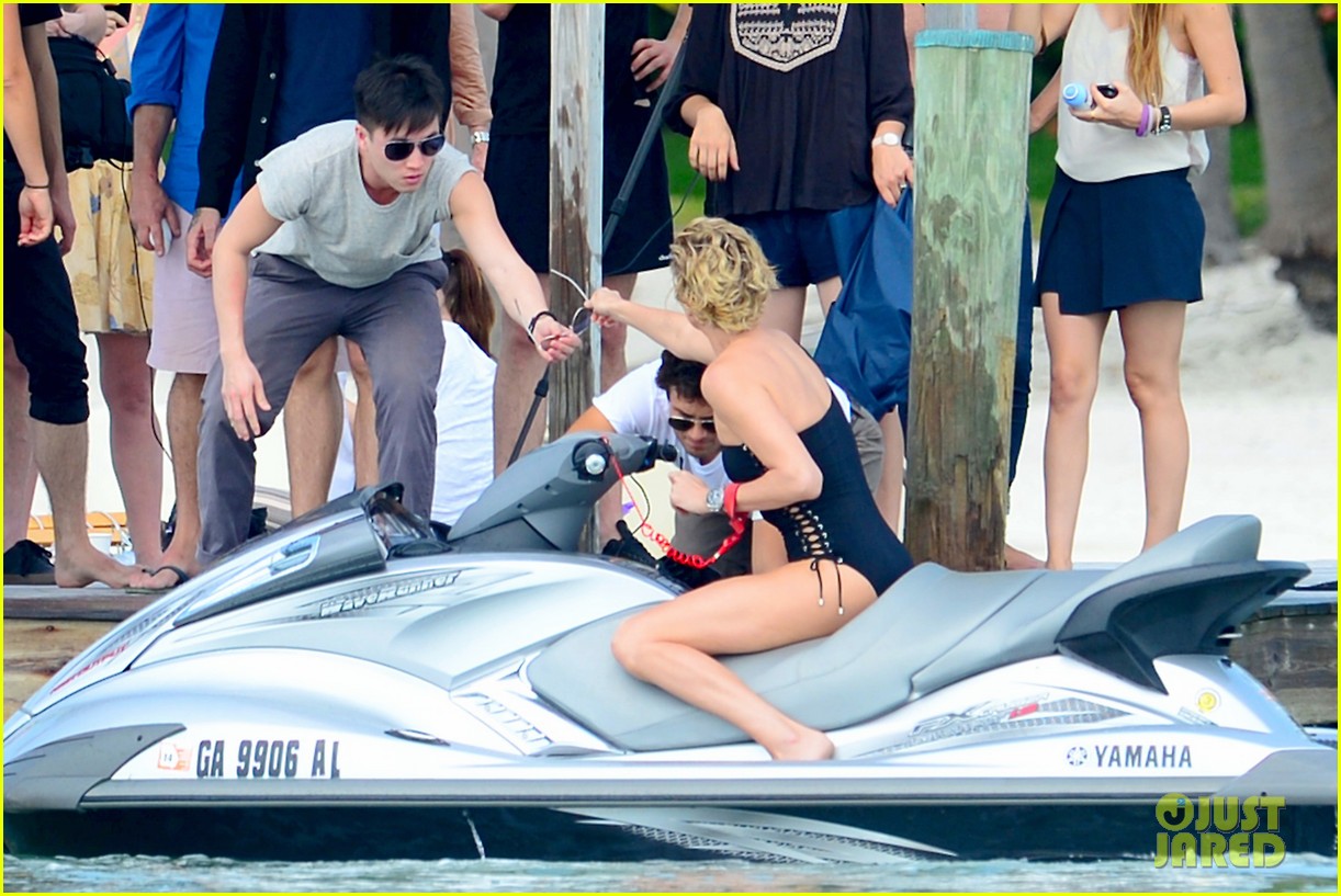 charlize therons bathing suit body is so enviable during jet ski shoot 033075468