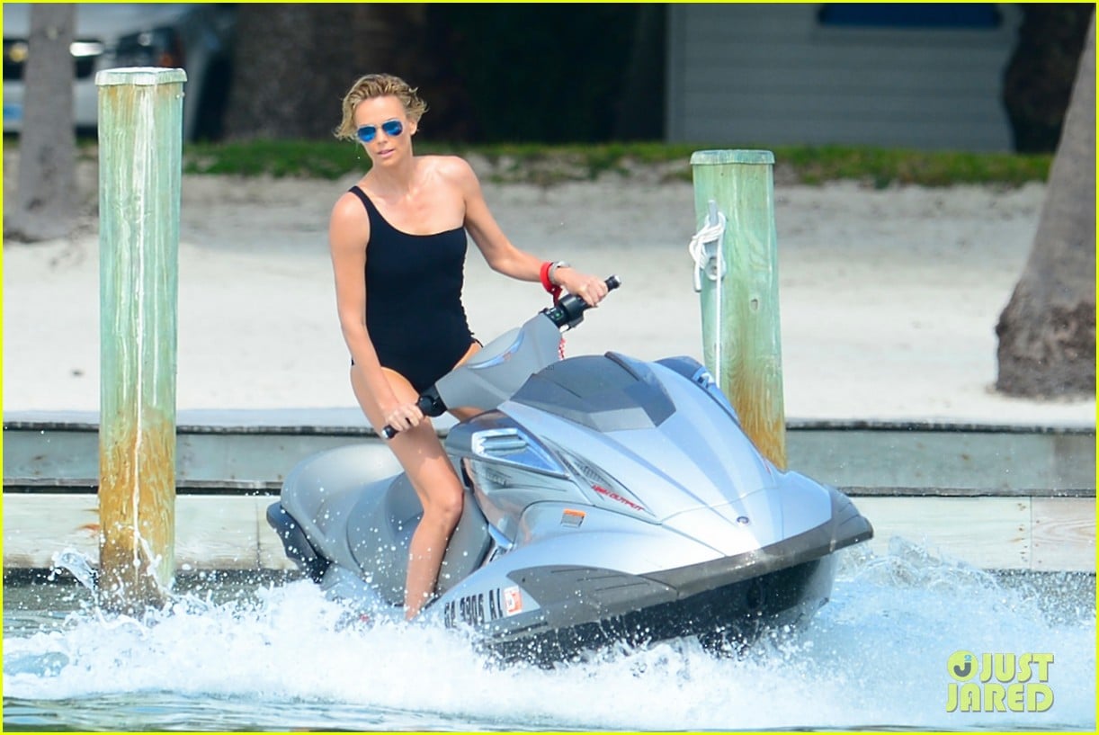 charlize therons bathing suit body is so enviable during jet ski shoot 073075472