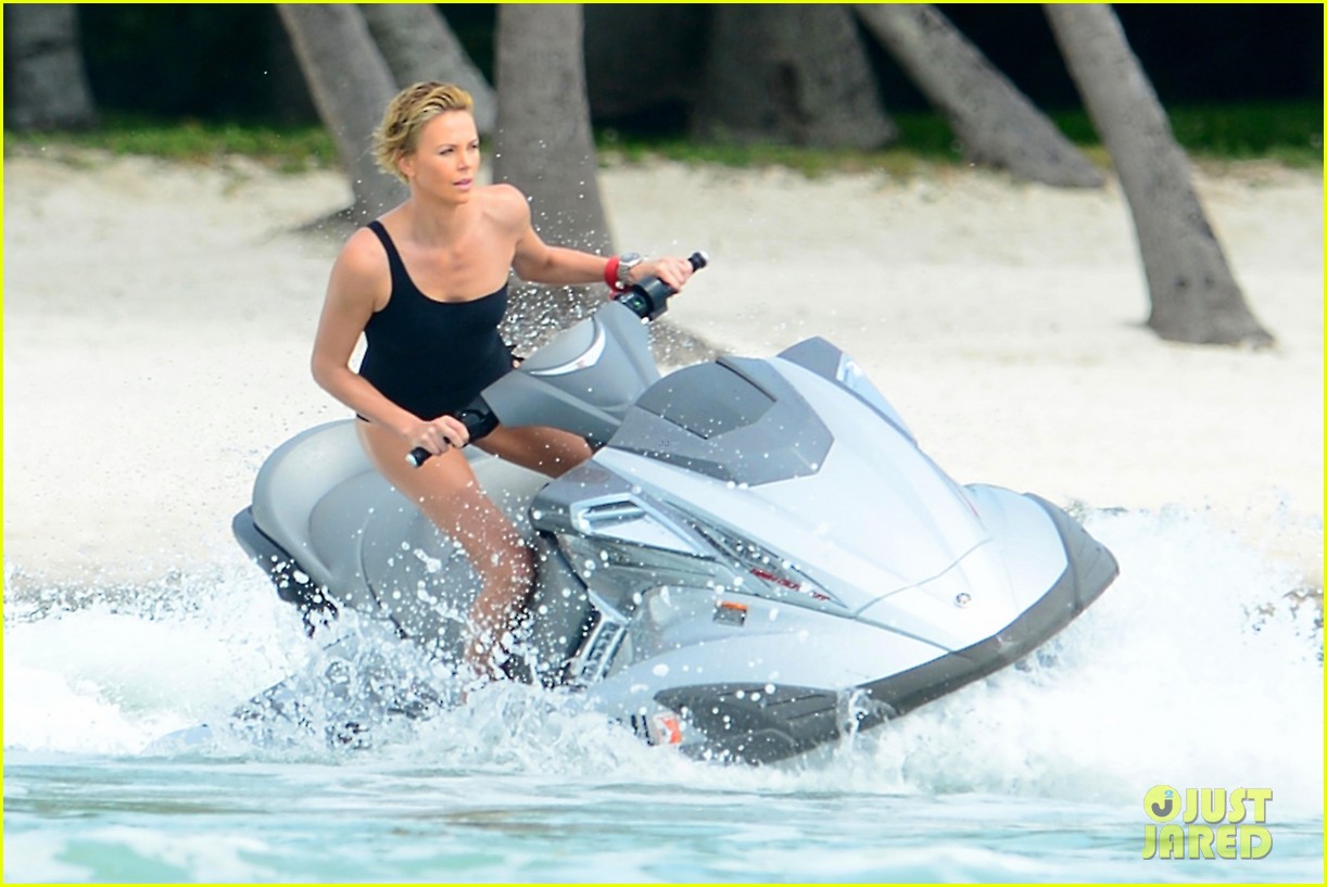 charlize therons bathing suit body is so enviable during jet ski shoot 09