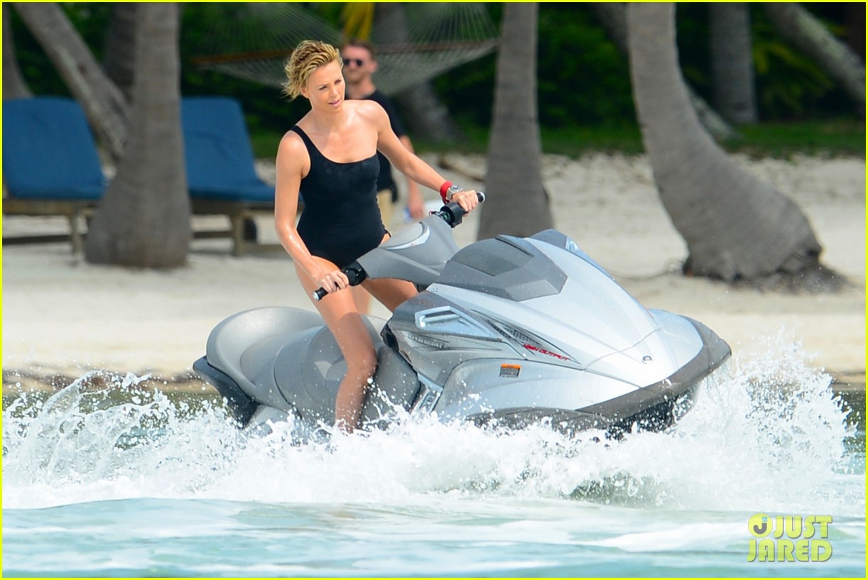 charlize therons bathing suit body is so enviable during jet ski shoot 103075475