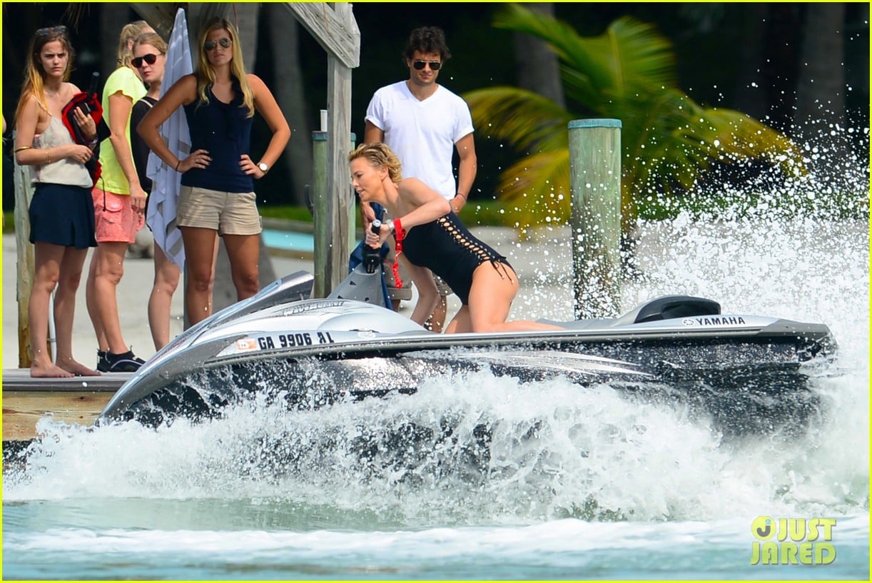 charlize therons bathing suit body is so enviable during jet ski shoot 13
