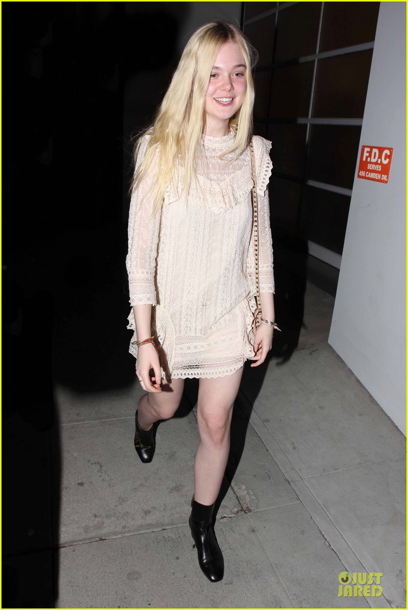 elle fanning teases the cameras in sheer dress at mr chow 01