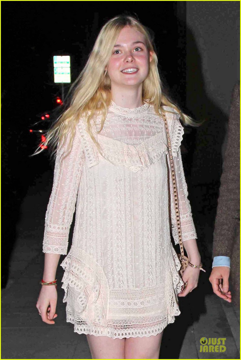 elle fanning teases the cameras in sheer dress at mr chow 02