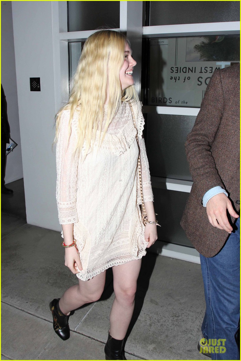 elle fanning teases the cameras in sheer dress at mr chow 11