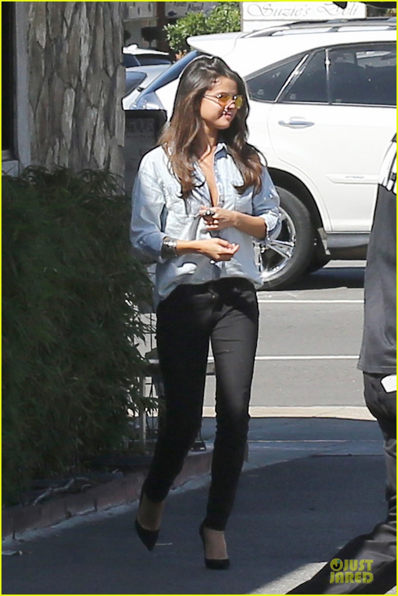 selena gomez teases us with low denim buttoned shirt 23
