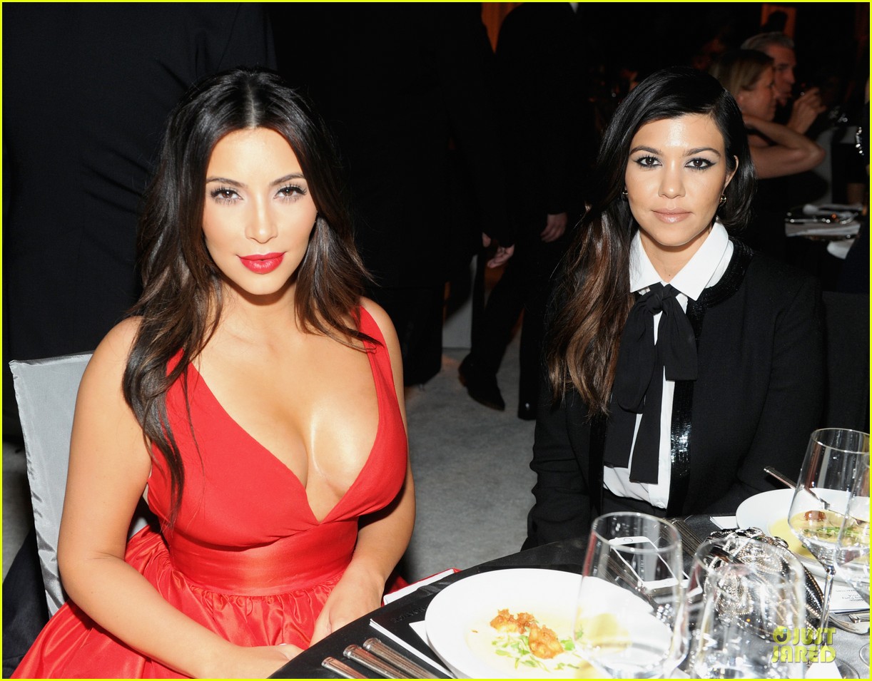 kim kardashian bares cleavage in red dress at elton john oscars party 2014 043064083