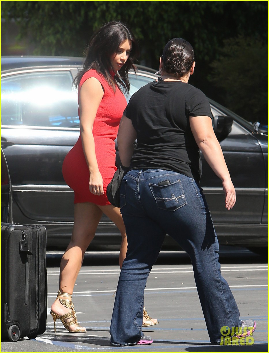 kim kardashian shows her figure in a tight little red dress 063072027