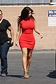 kim kardashian shows her figure in a tight little red dress 08