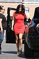 kim kardashian shows her figure in a tight little red dress 10