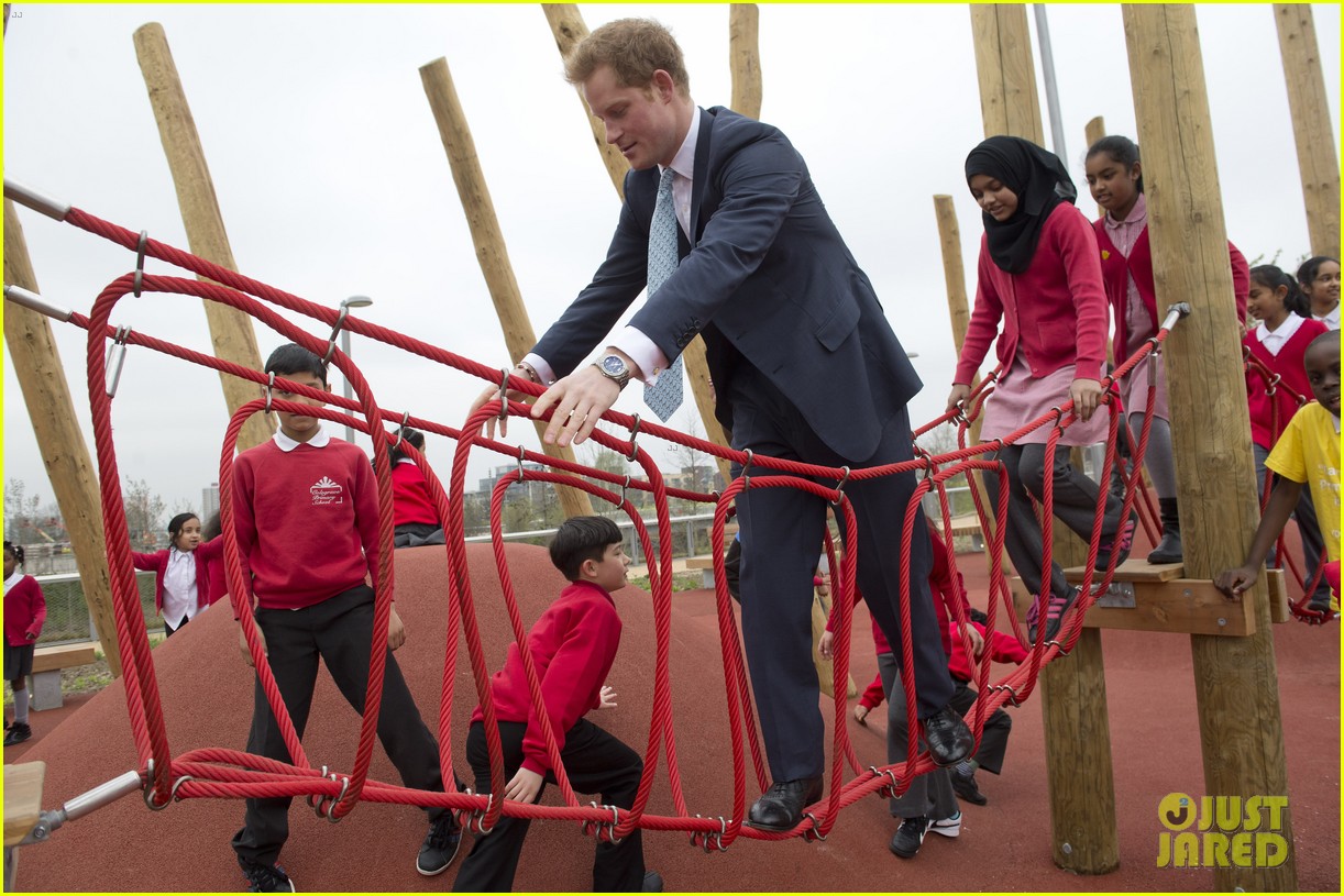 prince harry playing with kids at a playground 09