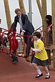 prince harry playing with kids at a playground 04