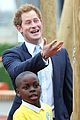 prince harry playing with kids at a playground 05