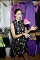 emmy rossum plays with shoes at under armour store launch 02