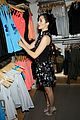 emmy rossum plays with shoes at under armour store launch 13