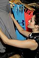 emmy rossum plays with shoes at under armour store launch 14