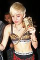 miley cyrus enters club fully clothed leaves in bra 02