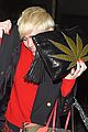 miley cyrus enters club fully clothed leaves in bra 04
