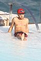 liam payne zayn malik lounge shirtless at the pool in rio 03