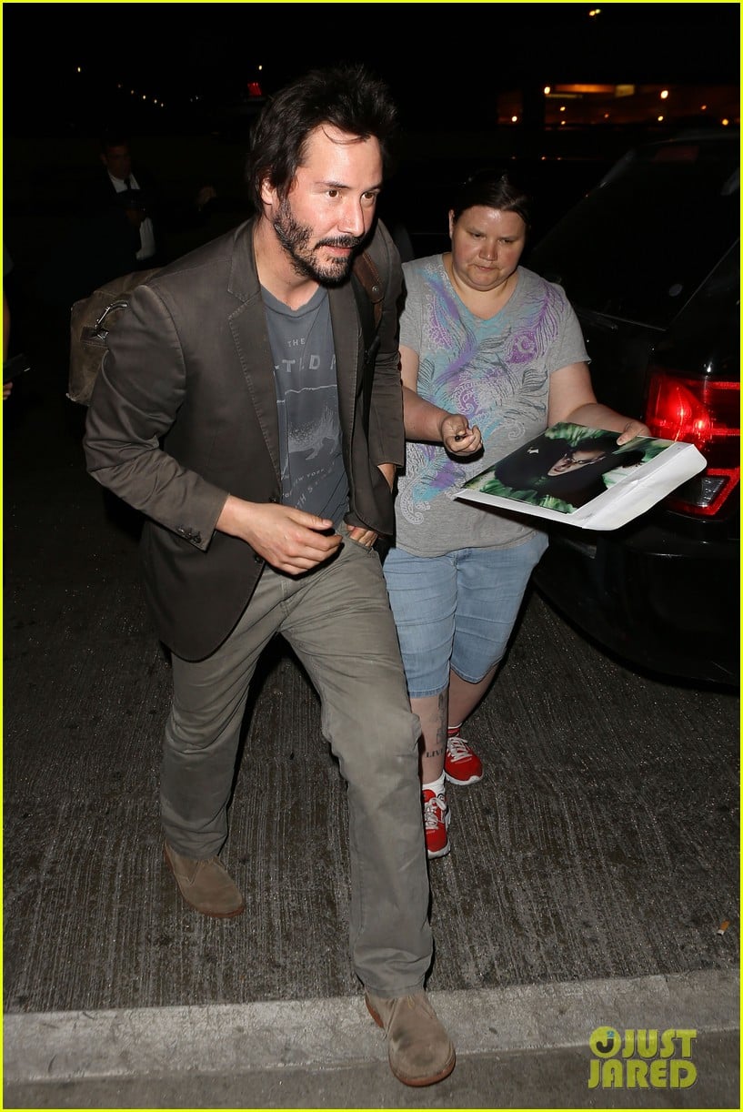 keanu reeves gets swarmed by fans at lax airport 073125028