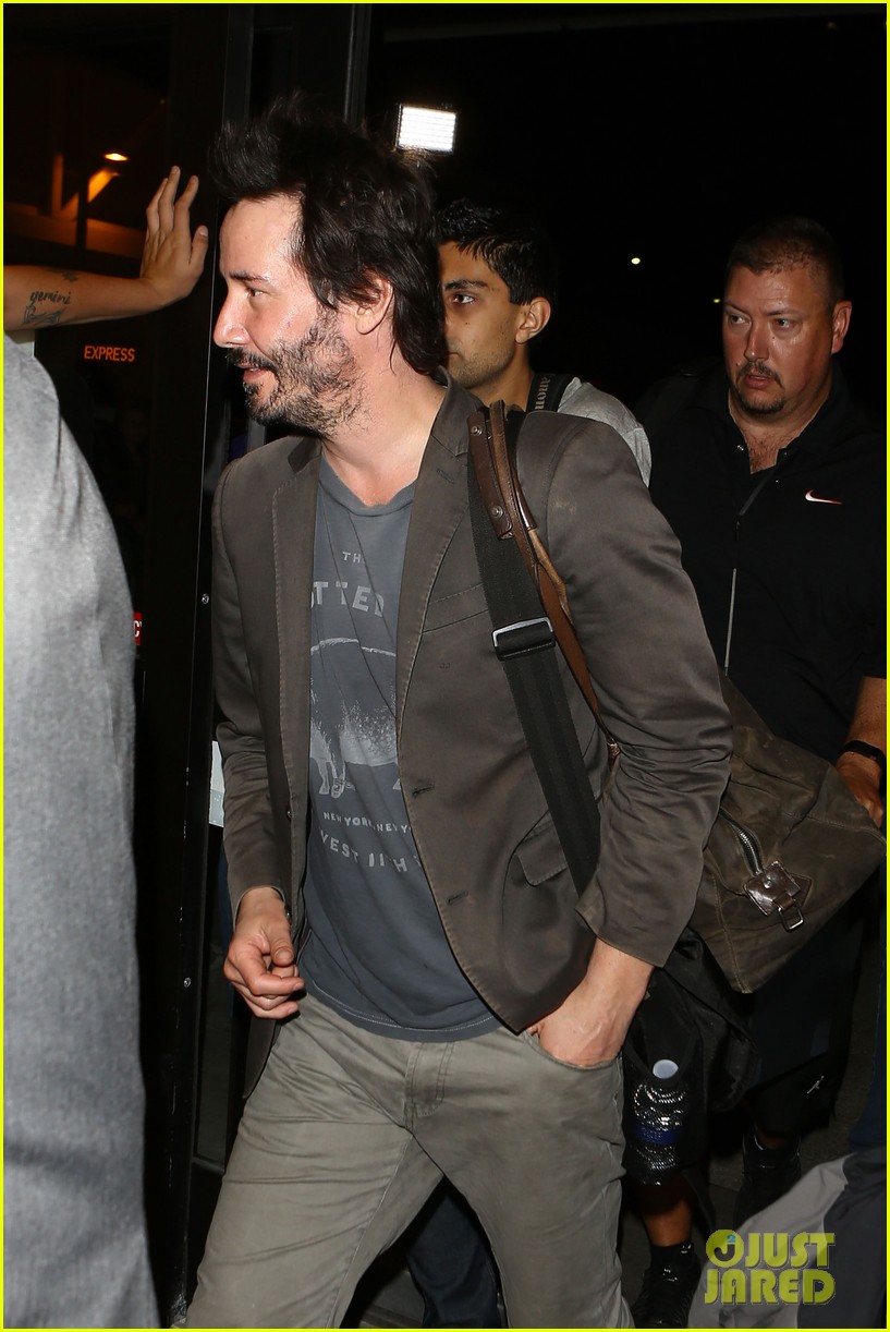 keanu reeves gets swarmed by fans at lax airport 143125035