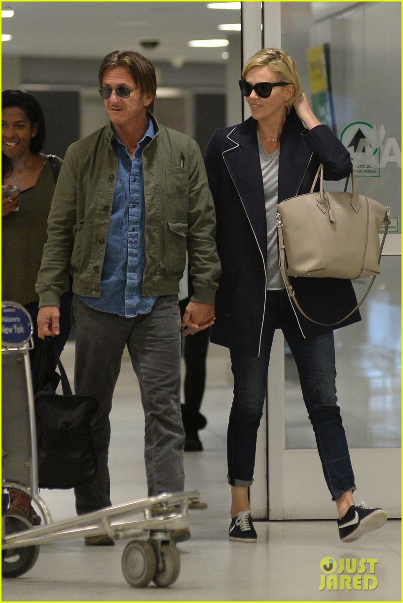 charlize theron sean penn hold hands upon new york arrival 203105574
