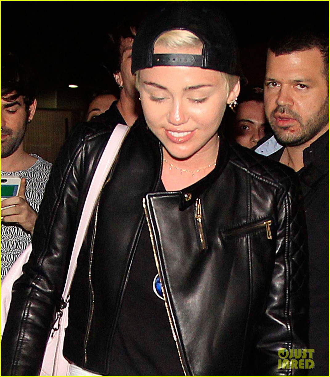 miley cyrus jets barcelona after topless photos 01