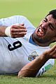 luis suarez banned from world cup for biting opponent 02