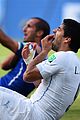 luis suarez banned from world cup for biting opponent 08