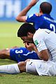 luis suarez banned from world cup for biting opponent 09