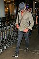 gerard butler shows off chest hair touching down at lax 05