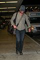 gerard butler shows off chest hair touching down at lax 06