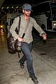 gerard butler shows off chest hair touching down at lax 09