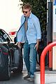 hayden christensen licks his lips while fueling his car 03