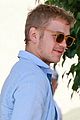hayden christensen licks his lips while fueling his car 04