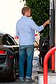 hayden christensen licks his lips while fueling his car 05