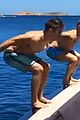zac efron goes shirtless backflip off a boat 02